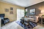 Photo of living area showing patio sliding doors